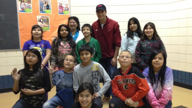 Christian Kowalchuk with kids in the baseball clinic in La Ronge, Sask. (Christian Kowalchuk/Submitted to CBC )