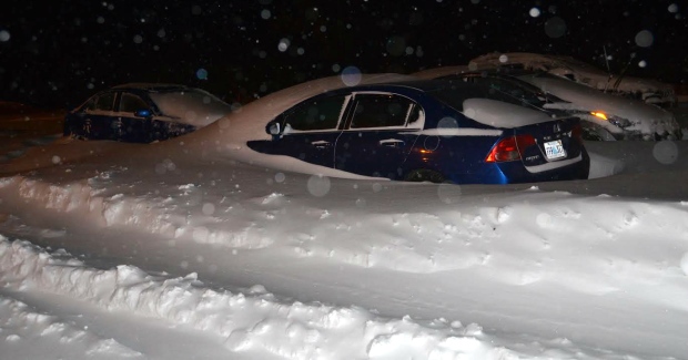 Saturday's storm meant vehicles parked in the parking lot were treated to this snow drift. (Submitted by Frank Isherwood) Image Courtesy of CBC News