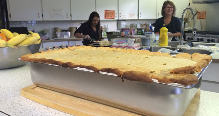 Volunteers at The Olive Tree prepare dinner for those in need in Lloydminster (Image Courtesy of CTV News)