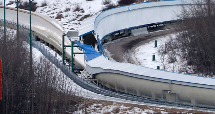 A tarp covers the intersection of the bobsled and luge tracks at Canada Olympic Park in Calgary, Alta., on Saturday, Feb. 6, 2016. (Larry MacDougal/THE CANADIAN PRESS)