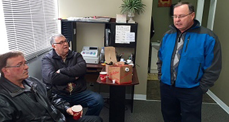 Bill Boyd meets with supporters at his campaign office in Kindersley. (CBC)