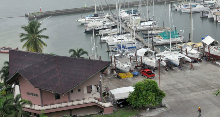 A man walks inside the compound of Holiday Ocean View Samal Resort a day after gunmen abducted a Norwegian resort manager, two Canadians and a Filipino woman. (Manuel Canyon/Associated Press)