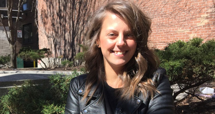 Sara Spears, who works at a Toronto advertising firm, got her tattoo on Bunz in exchange for a bottle of gin and half a kilo of coffee. (Aaron Saltzman/CBC)