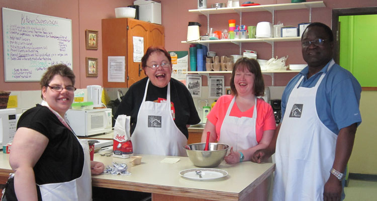WCA clients baking cookies for Mother's Day Tea - Image Courtesy of WCA