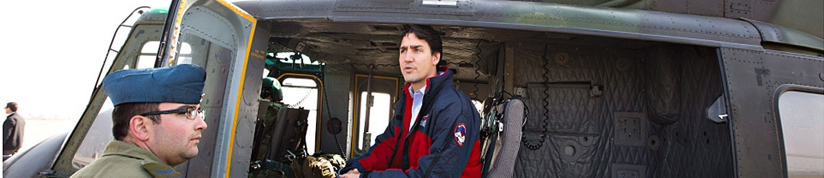 Prime Minister Justin Trudeau takes a helicopter tour of the devastation during a visit to Fort McMurray, Alta., Friday, May 13, 2016. (THE CANADIAN PRESS/Jason Franson)